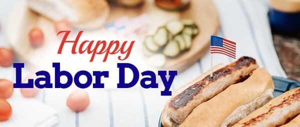 Happy Labor Day written across picnic table of food